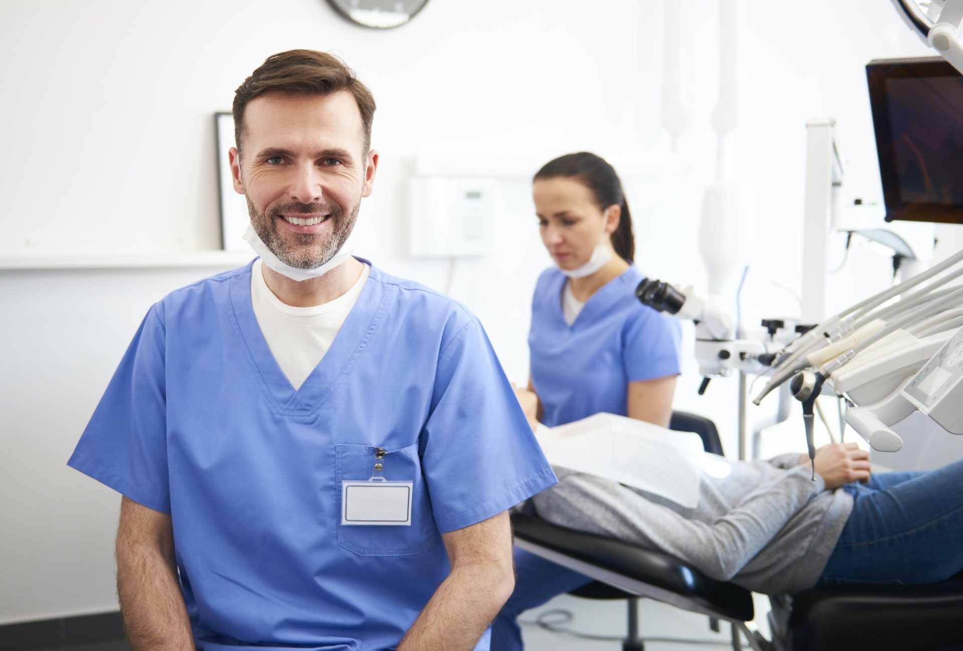 portrait of smiling male dentist in dentist s clinic