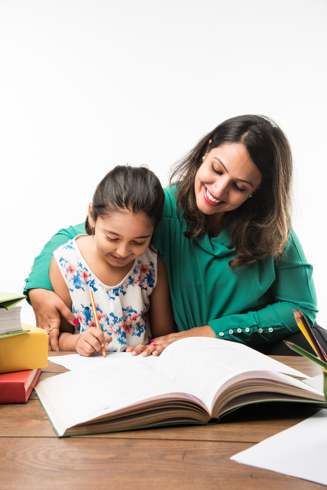 Indian,Girl,Studying,With,Mother,Or,Teacher,At,Study,Table